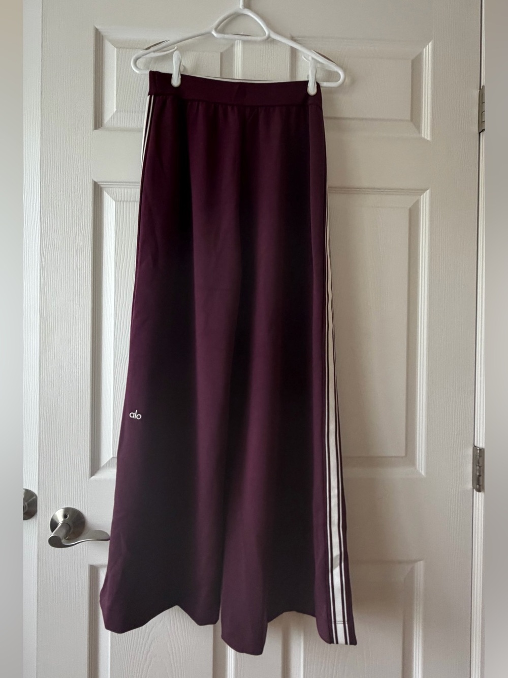 ALO Yoga Wide-Leg Track Pants in Plum with White Side Stripes - Picture 3 of 10
